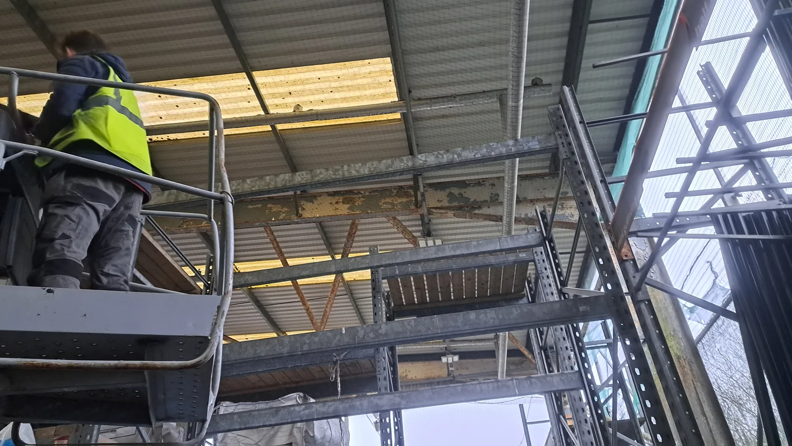Powered access work within retail racking